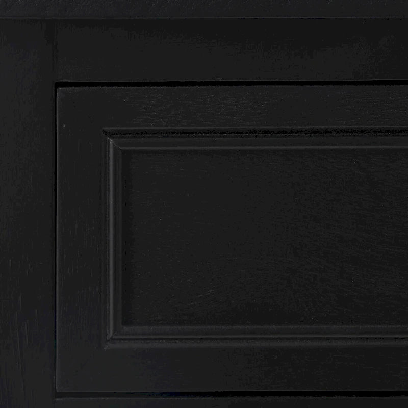 Meuble de rangement en bois noir avec porte en rotin, tiroir et poignées dorées